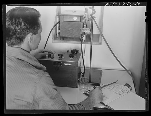Untitled photo, possibly related to: J.D. Ponting, junior chemist in division of commodity processing, conducts a galvanometer test on vitamin C content of dehydrated vegetable. Regional agricultural research laboratory, Albany, California