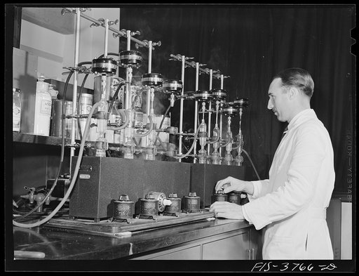 Dr. G.I. Jones, associate chemist, runs vitamin B complex determination test on dehydrated vegetables. Regional agricultural research laboratory, Albany, California