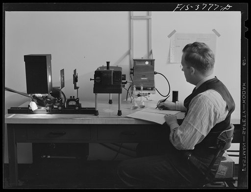 Untitled photo, possibly related to: Dr. H.J. Dutton, assistant chemist, runs a spectrometric test for determination of carotene content of dehydrated vegetables. Regional agricultural research laboratory, Albany, California