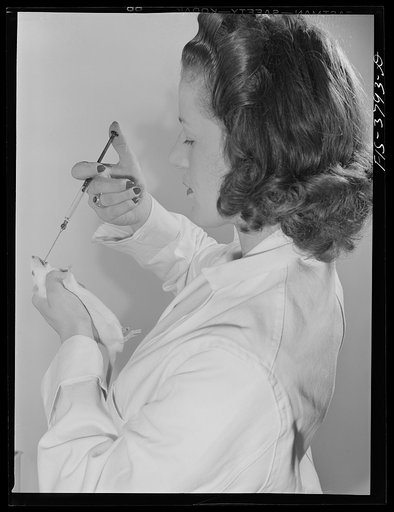 Feeding white rat with vitamin-rich solution from dehydrated eggs; this is part of procedure in bio-assay method of determining vitamin content of dehydrated eggs. Regional agricultural research laboratory, Albany, California