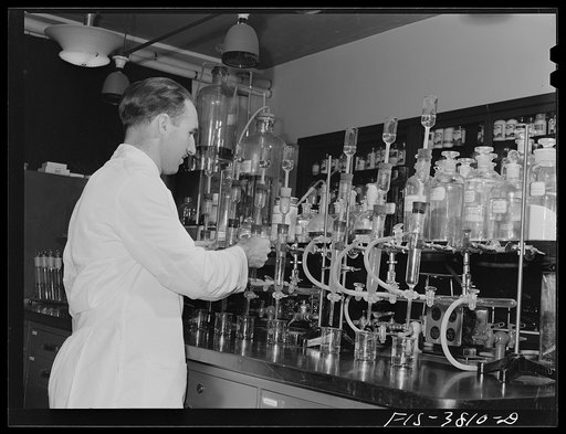 Dr. G.I. Jones, associate chemist, conducts tests in determination of vitamin B complex in dehydrated vegetables. Regional agricultural research laboratory, Albany, California. This test must be conducted in light of certain quality which will not destroy vitamins in solutions