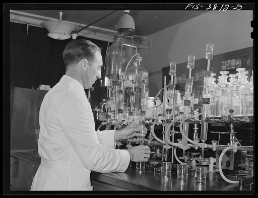 Dr. G.I. Jones, associate chemist, conducts tests in determination of vitamin B complex in dehydrated vegetables. Regional agricultural research laboratory, Albany, California. This test must be conducted in light of certain quality which will not destroy vitamins in solution