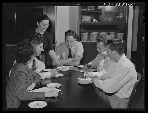 Samples of cooked dehydrated carrots are passed around for individual judgment as to appearance. Regional agricultural research laboratory, Albany, California
