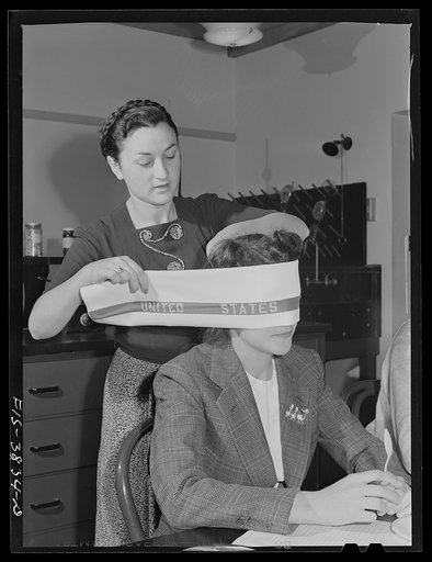 Blindfolding a tester of cooked dehydrated spinach at the regional agricultural research laboratory. Albany, California