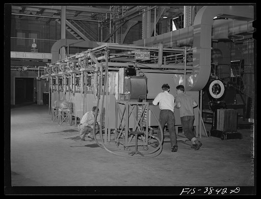 Charging the tunnel dehydrater at the regional agricultural research laboratory. Albany, California