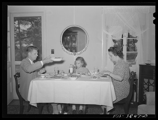 Untitled photo, possibly related to: Sheffield, Alabama. (Tennessee Valley Authority (TVA)). Kenneth C. Hall and family at dinner in their home at a defense housing project
