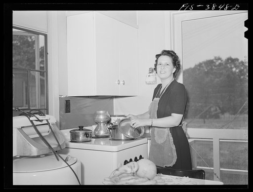 Untitled photo, possibly related to: Sheffield, Alabama (Tennessee Valley Authority (TVA)). Mrs. Kenneth C. Hall prepares a balanced meal for her family
