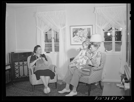 Untitled photo, possibly related to: Sheffield, Alabama (Tennessee Valley Authority (TVA)). Kenneth C. Hall and family in the living room of their home on a defense housing project