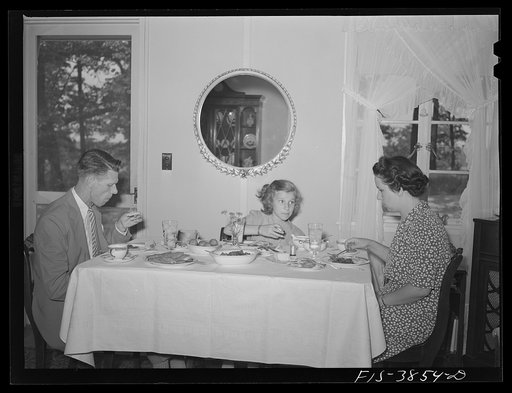 Sheffield, Alabama. (Tennessee Valley Authority (TVA)). Kenneth C. Hall and family at dinner in their home at a defense housing project