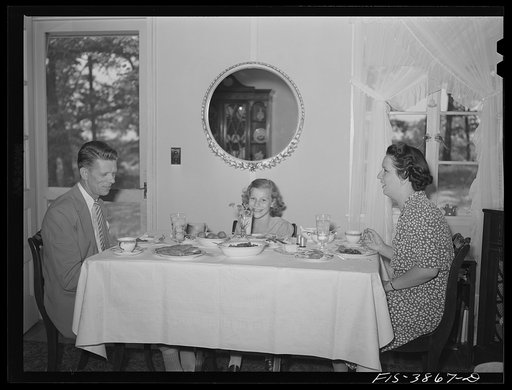 Untitled photo, possibly related to: Sheffield, Alabama. (Tennessee Valley Authority (TVA)). Kenneth C. Hall and family at dinner in their home at a defense housing project