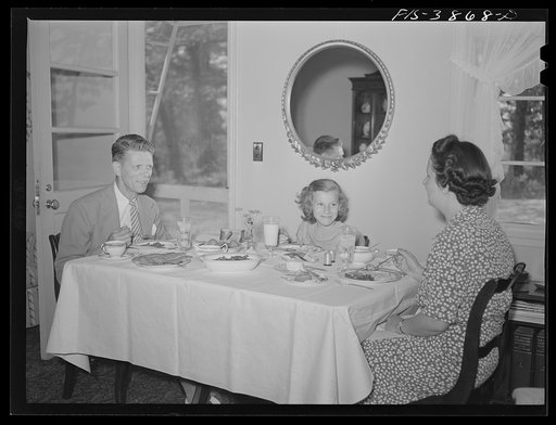 Untitled photo, possibly related to: Sheffield, Alabama. (Tennessee Valley Authority (TVA)). Kenneth C. Hall and family at dinner in their home at a defense housing project