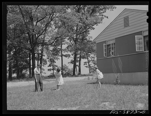 Untitled photo, possibly related to: Sheffield, Alabama (Tennessee Valley Authority (TVA)). Kenneth C. Hall and family play croquet outside their home built by the T VA
