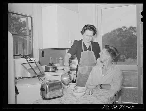 Untitled photo, possibly related to: Sheffield, Alabama (Tennessee Valley Authority (TVA)). Mrs. Hall prepares breakfast for her husband before he leaves for work at the aluminum plant