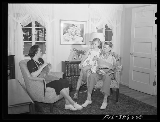 Untitled photo, possibly related to: Sheffield, Alabama (Tennessee Valley Authority (TVA)). Kenneth C. Hall and family in the living room of their home on a defense housing project