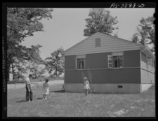 Sheffield, Alabama (Tennessee Valley Authority (TVA)). Kenneth C. Hall and family play croquet outside their home built by the T VA