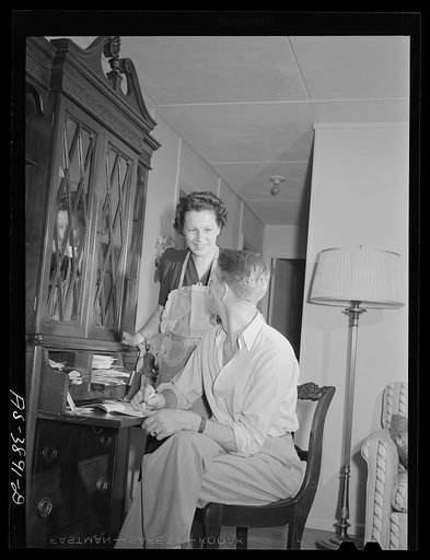 Untitled photo, possibly related to: Sheffield, Alabama (Tennessee Valley Authority (TVA)). Kenneth C. Hall and family in the living room of their home on a defense housing project
