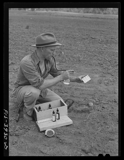 Lauderdale County, Alabama. Tennessee Valley Authority (TVA). Julien Case testing soil on his farm