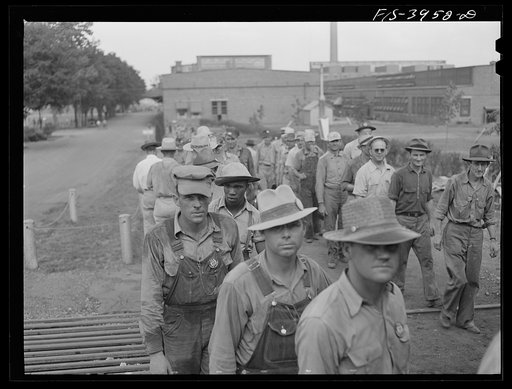 Untitled photo, possibly related to: Wilson Dam, Alabama (Tennessee Valley Authority (TVA)). Workers checking out at end of shift at a chemical engineering plant