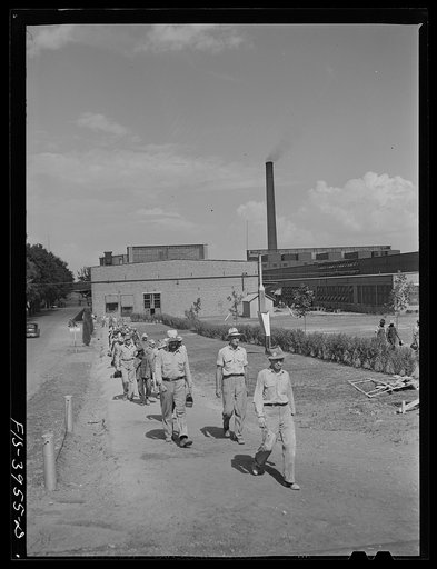 Untitled photo, possibly related to: Wilson Dam, Alabama (Tennessee Valley Authority (TVA)). Workers leaving the chemical engineering plant