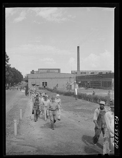 Untitled photo, possibly related to: Wilson Dam, Alabama (Tennessee Valley Authority (TVA)). Workers leaving the chemical engineering plant
