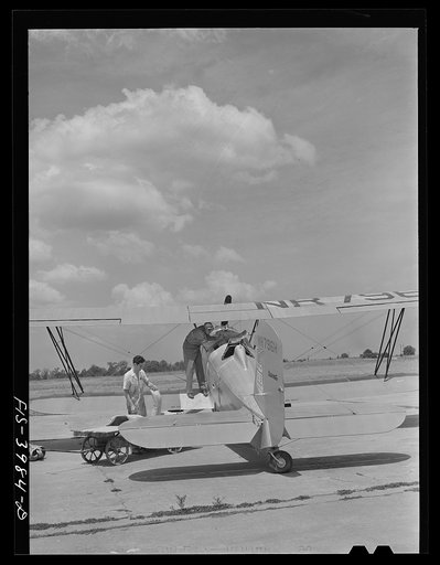 Untitled photo, possibly related to: Wilson Dam, Alabama (Tennessee Valley Authority (TVA)). Loading insecticide into plane used in malaria control work