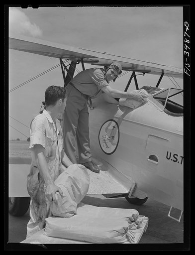 Wilson Dam, Alabama (Tennessee Valley Authority (TVA)). Loading insecticide into plane used in malaria control work