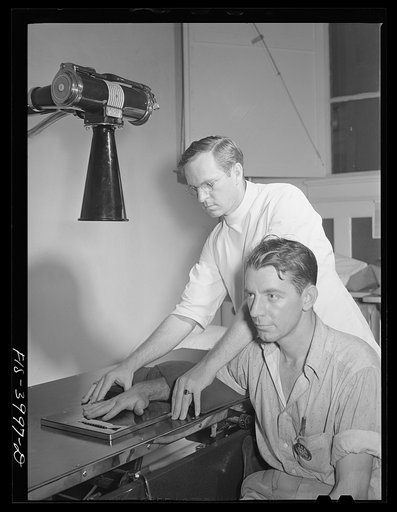 Untitled photo, possibly related to: Wilson Dam, Alabama (Tennessee Valley Authority (TVA)). Workers in chemical plant receive free medical care