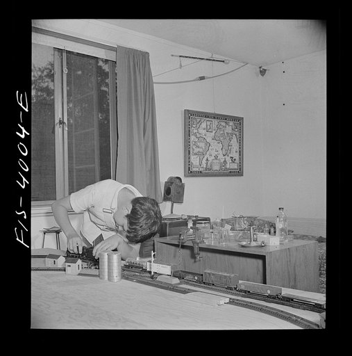Untitled photo, possibly related to: Greenbelt, Maryland. Child's bedroom in a house in which a thirteen year-old boy has rigged up model trains and a chemical laboratory