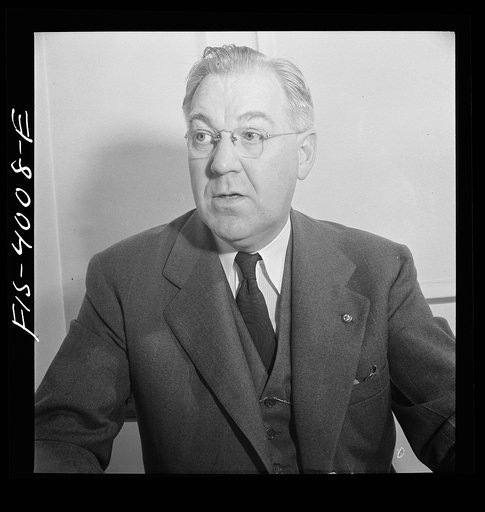 Untitled photo, possibly related to: Washington, D.C. Mr. Lund, who is the head of the District Red Cross, at his desk in the District chapter house
