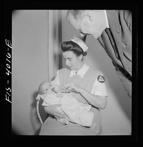 Washington, D.C. Mr. Lund, who is the head of District Red Cross, visits Children's Hospital, where General MacArthur's niece is a nurse's aid