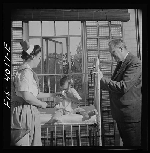 Untitled photo, possibly related to: Washington, D.C. Mr. Lund, who is head of the District Red Cross, visits the Children's Hospital where General MacArthur's niece is a nurse's aid