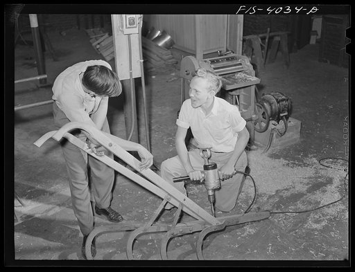Knox County, Tennessee (Tennessee Valley Authority (TVA)). Farm boy uses an electric drill at Farragut Agricultural School