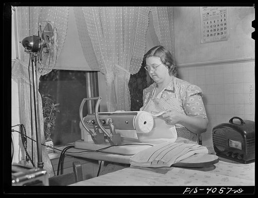 Knox County, Tennessee (Tennessee Valley Authority (TVA)). Mrs. Robert Bacon, farm wife, with some of her electric appliances: fan, ironer, radio