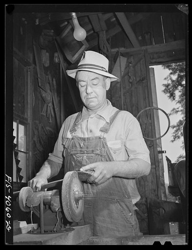 Untitled photo, possibly related to: Knox County, Tennessee (Tennessee Valley Authority (TVA)). Mr. Robert Bacon with electric chick brooder