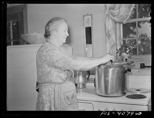 Knox County, Tennessee (Tennessee Valley Authority (TVA)). Mrs. Wiegel uses a pressure cooker on her electric stove