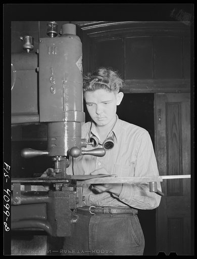 Untitled photo, possibly related to: Knoxville, Tennessee (Tennessee Valley Authority (TVA)). Operating nibbler for sheet metal in training for war production at Stair Vocational High School