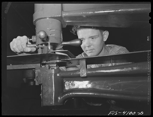 Knoxville, Tennessee (Tennessee Valley Authority (TVA)). Operating nibbler for sheet metal in training for war production at Stair Vocational High School