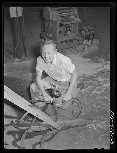 Untitled photo, possibly related to: Knox County, Tennessee (Tennessee Valley Authority (TVA)). Farm boy uses an electric drill at Farragut Agricultural School