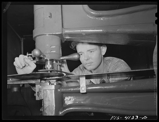 Untitled photo, possibly related to: Knoxville, Tennessee (Tennessee Valley Authority (TVA)). Operating nibbler for sheet metal in training for war production at Stair Vocational High School