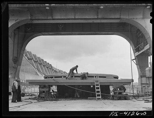 Cherokee Dam, Tennessee (Tennessee Valley Authority (TVA)). Working on the cover of a 30,000 kilowatt generator under a 250 ton gantry crane