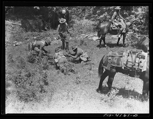 Fort Riley, Kansas. Setting a light air-cooled machine gun during a field problem of the cavalry