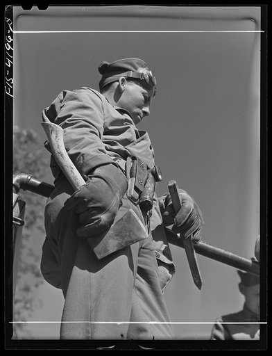 Fort Riley, Kansas. A Signal Corps man attached to a truck unit