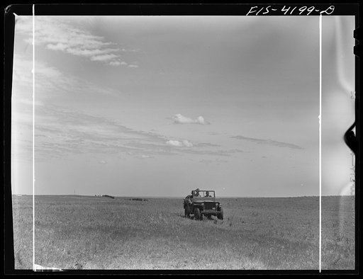 Fort Riley, Kansas. Jeep leading a column of cavalry during a field problem