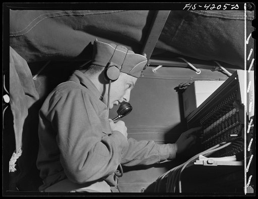 Fort Riley, Kansas. Telephone communication from the message center established by the Signal Corps unit during a field problem