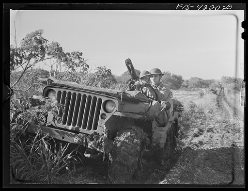 Fort Riley, Kansas. A jeep of a mechanized cavalry reconnaissance unit carrying a thirty caliber machine gun during a field problem