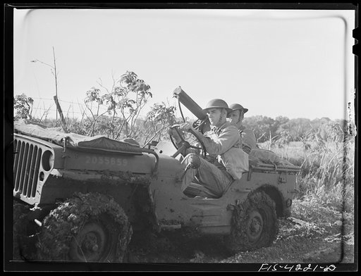 Untitled photo, possibly related to: Fort Riley, Kansas. A jeep of a mechanized cavalry reconnaissance unit carrying a thirty caliber machine gun during a field problem