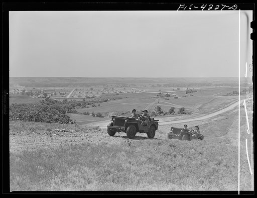 Untitled photo, possibly related to: Fort Riley, Kansas. Jeeps of a mechanized cavalry reconnaissance unit going out on a field problem