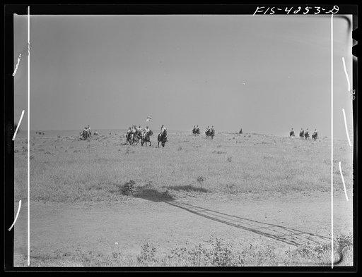 Fort Riley, Kansas. Cavalry coming across country during a field problem