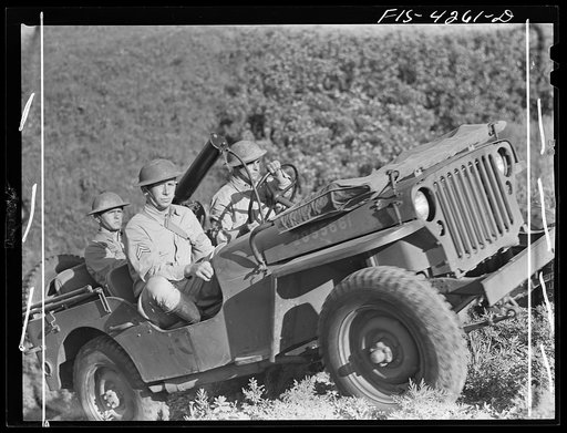 Fort Riley, Kansas. Jeep coming up a steep grade during a field problem