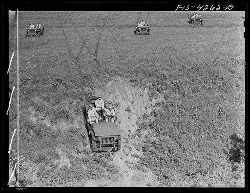 Fort Riley, Kansas. Jeeps going down a steep grade during a training demonstration